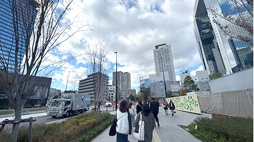 Follow the path straight toward the Umeda Sky Building.