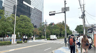 Cross the street and head toward the main entrance of the building on your right.