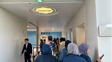 At the 3rd floor, wait in line for the elevator to the observatory.
