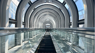 Ride the see-through escalator to the ticket counter on the 39th floor.